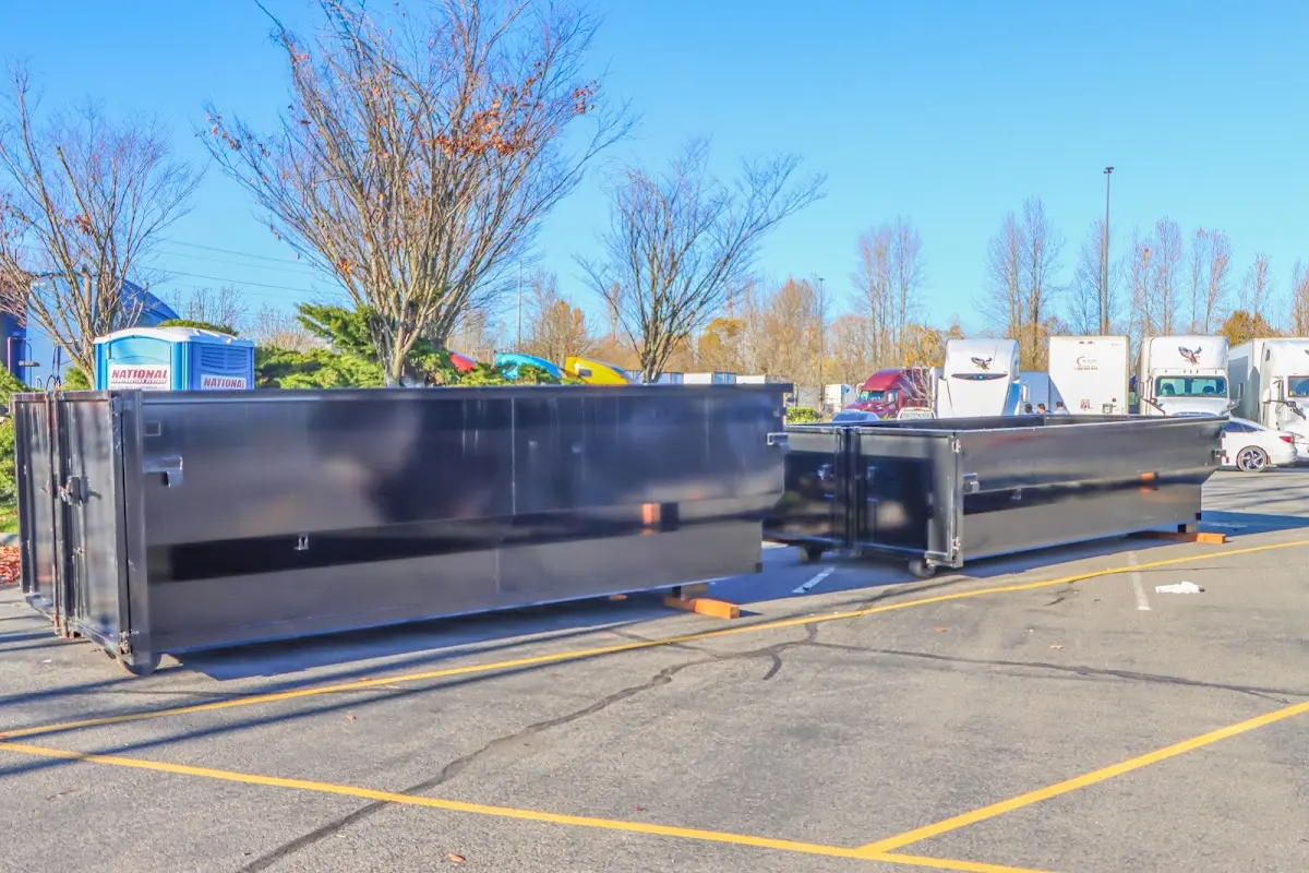 Professional dumpster rental service with roll-off container on residential driveway in Cape Girardeau